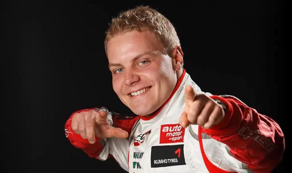 Valtteri Bottas smiling and pointing at the camera